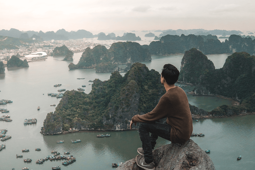 US expat overlooking water and islands below