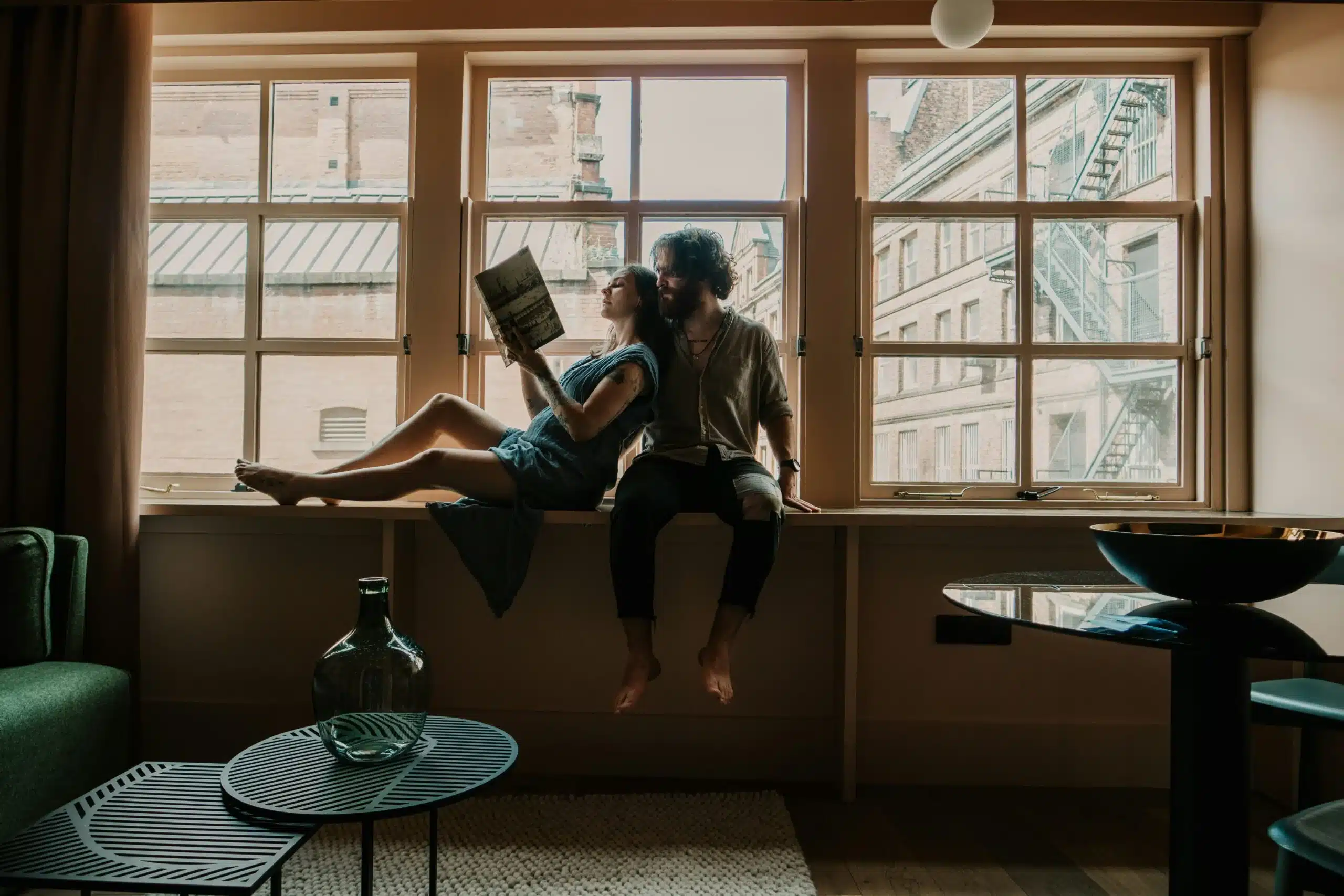 A couple relaxing in a short-term rental, representing Airbnb income and the tax considerations that come with hosting or earning from rental properties.