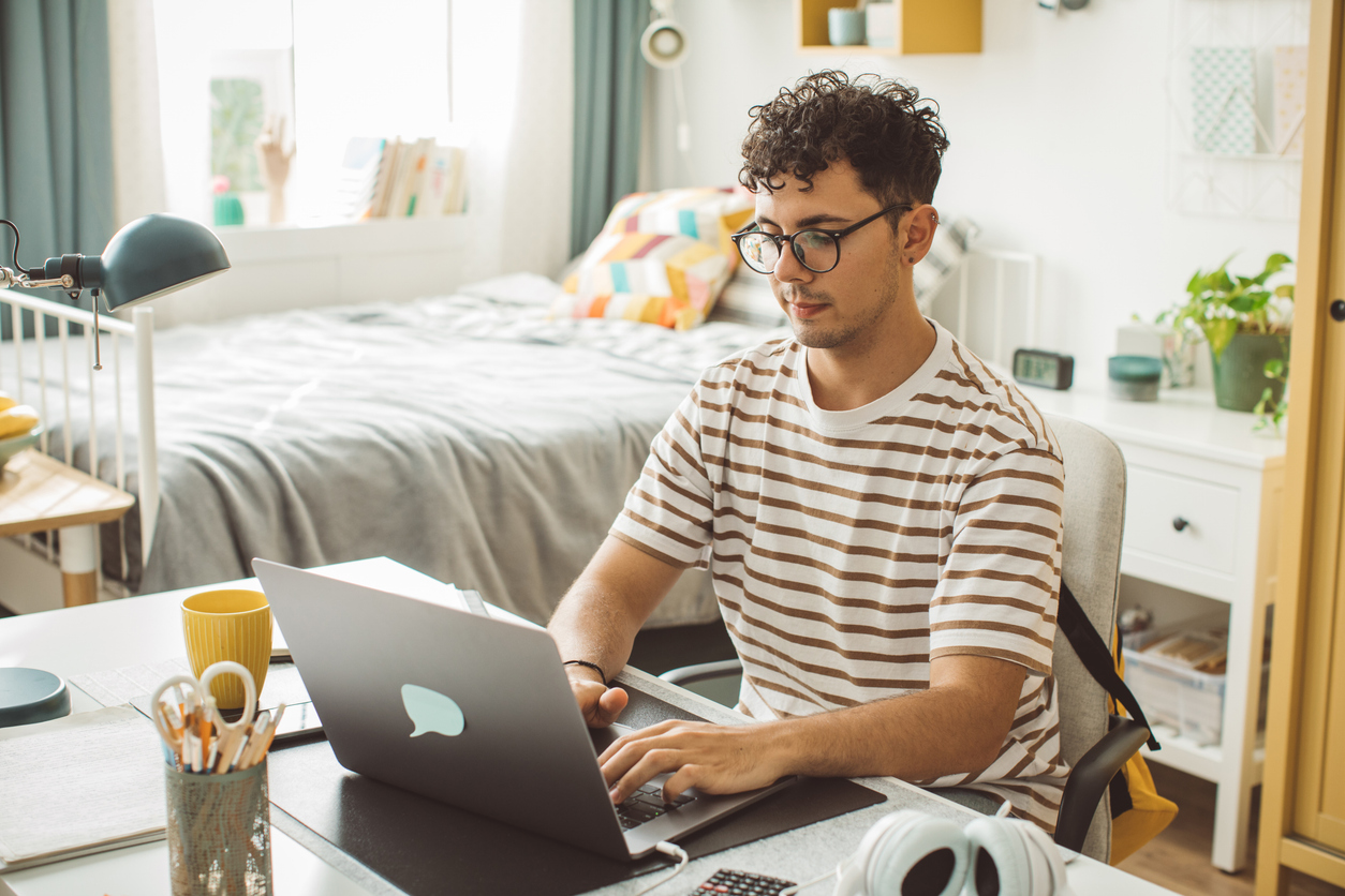 American expat looking stressed while reviewing financial documents related to FATCA reporting