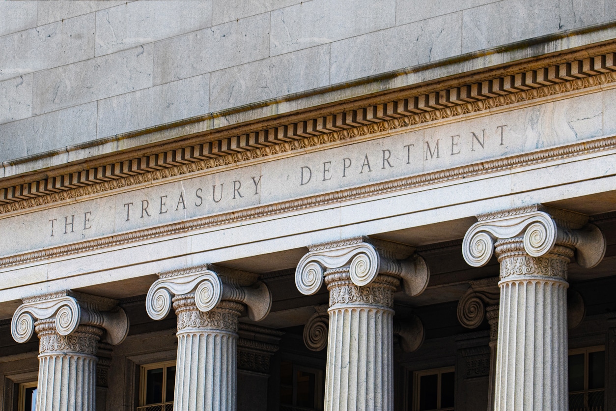 Facade of the US Treasury Department building showing classical columns and engraved department name, headquarters overseeing IRS operations during government shutdown