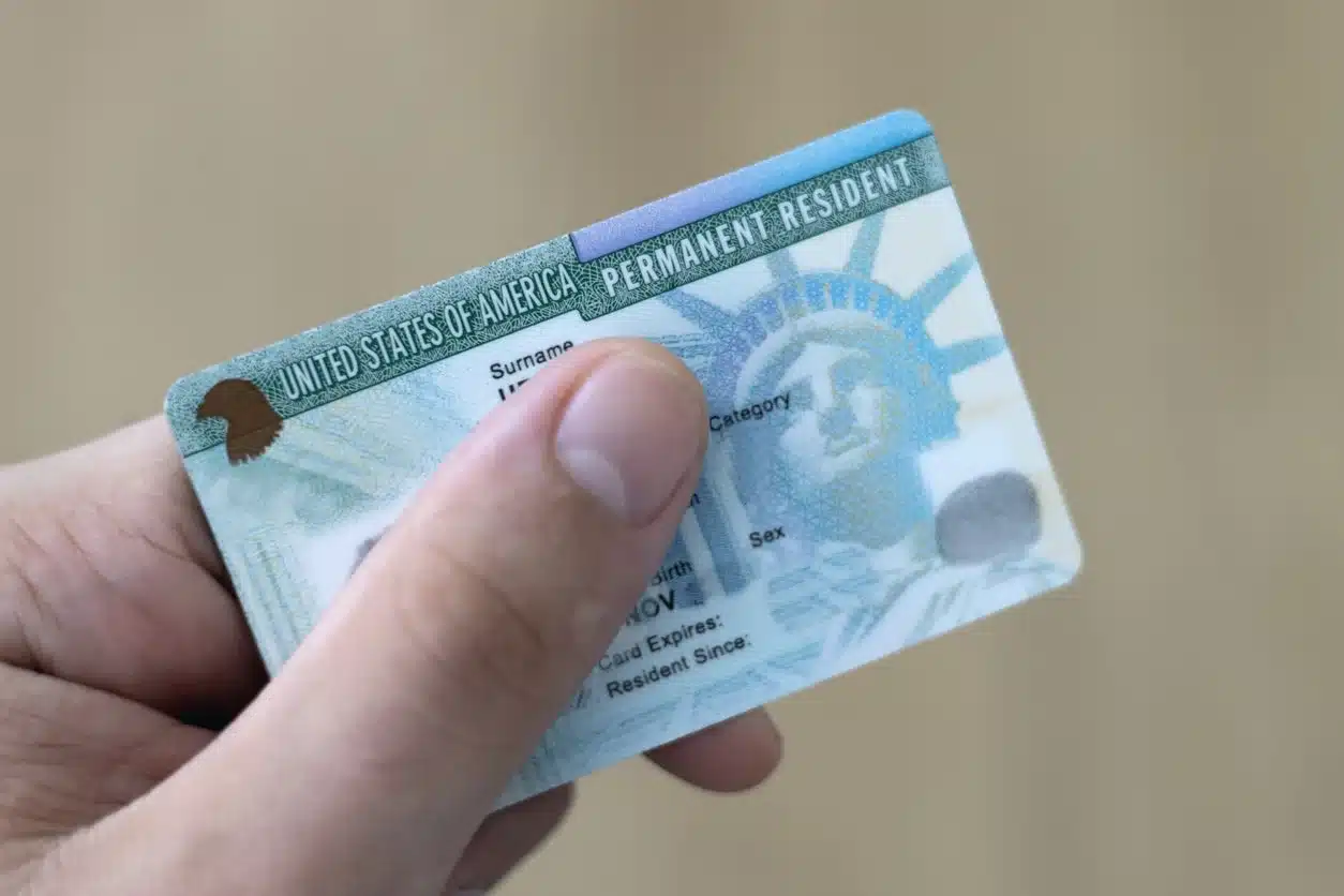 U.S. green card used to illustrate U.S. tax rules for foreigners