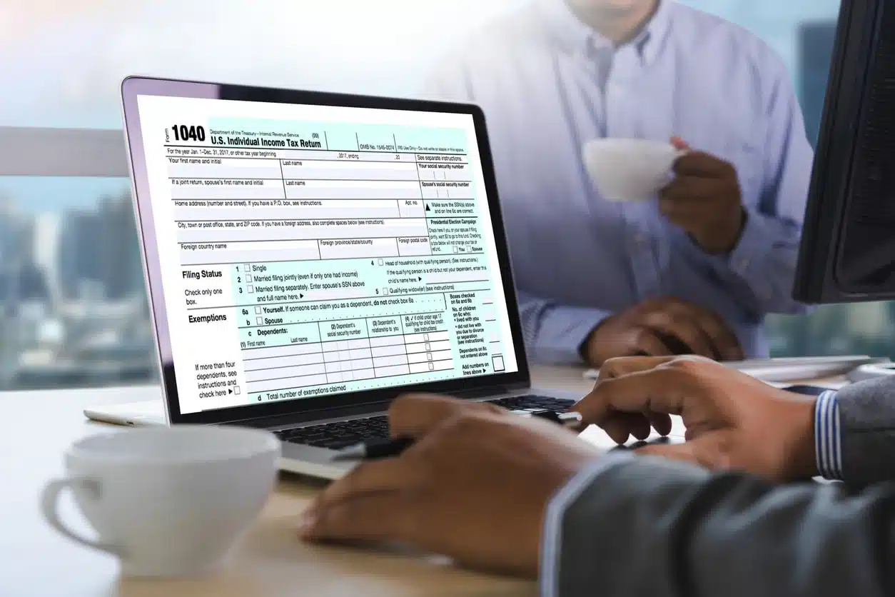 Man e-filing Us tax returns on a computer