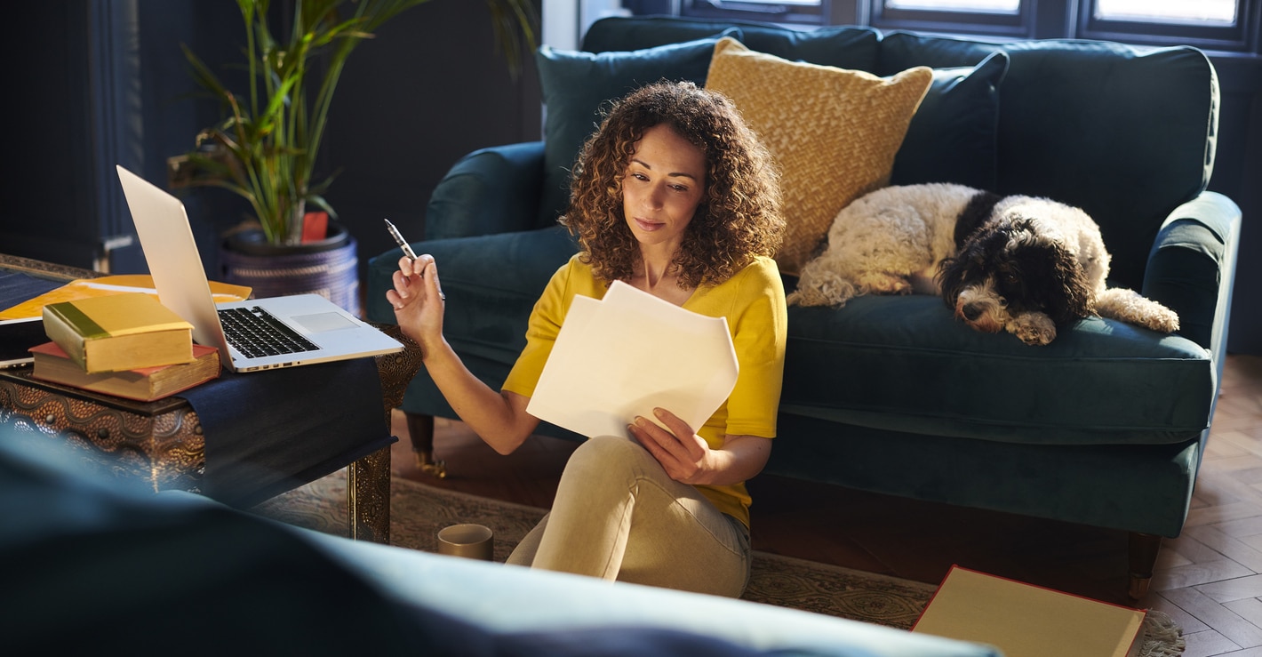 Woman reviewing tax filing documents as a dual citizen